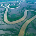 Australia, River snakes through coastal mudflats