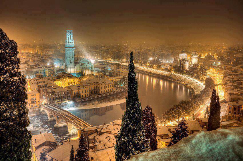 Winters night over the town of Verona in Italy